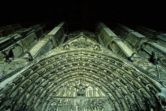 Pilgrim's-eye view of the assertive, richly-decorated central portal.