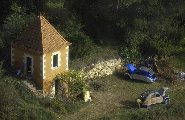 A 2CV enthusiast  below the perched village of Roussillon, Provence.