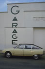 Citroën GS Pallas poses before an art déco garage facade. (46kb)